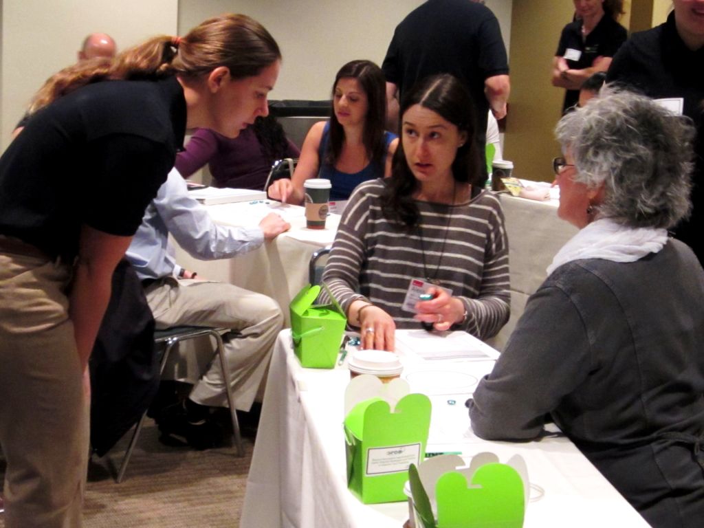 ORCA member explaining concepts to a participant at a workshop